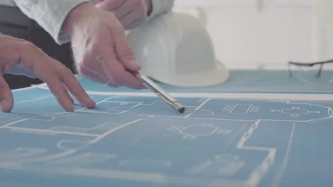 Architect and Engineer in a team discussing house blueprints Video stock 133055058