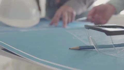 Architect and Engineer in a team discussing house blueprints Video stock 133055122