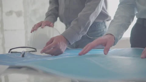 Architect and Engineer in a team discussing house blueprints Video stock 133055198