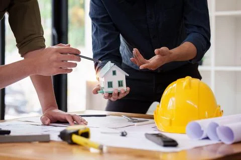 Architect and Engineer working with blueprints for architectural plan, engineer Foto stock