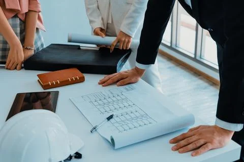 Architect and engineer working with drawing. uds Fotos de archivo