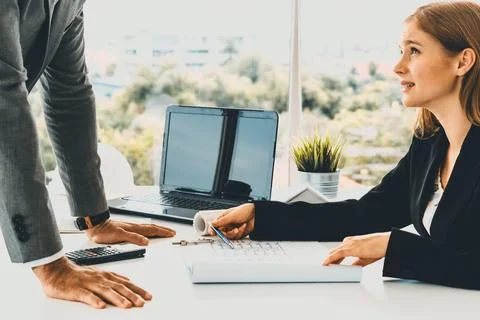 Architect and engineer working with drawing. uds Fotos de archivo