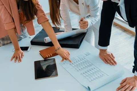 Architect and engineer working with drawing. uds Fotos de archivo