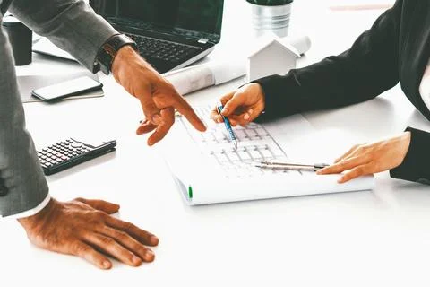 Architect and engineer working with drawing. uds Fotos de archivo