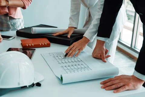 Architect and engineer working with drawing. uds Stock Photos