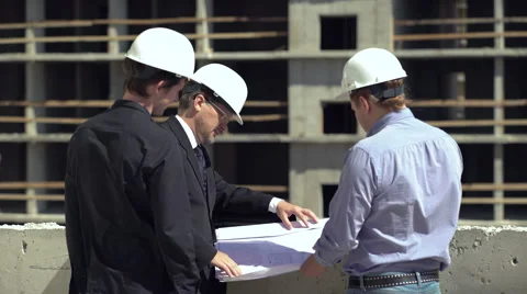 Architect and his assistant talking to the foreman Stock Footage 65170839