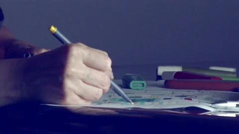 Architect and interior designer plans a build - makes notes and marks on Stock Footage 226336562