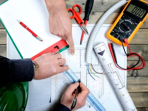 Architect and technician analyze the project of a residential house Stock-Fotos