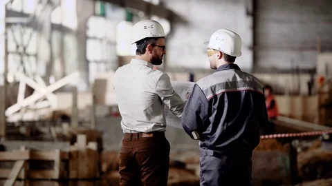 Architect and worker at the construction site. Construction of an industrial Video stock 76642684