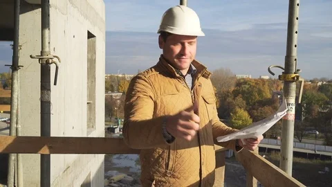 Architect browsing building project, shows ok to camera. 库存影片 72360397