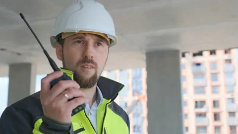 Architect Builder talking on the radio building under construction. Engineer in Video stock 113120834