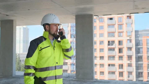 Architect Builder talking on the radio building under construction. Engineer in Video stock 113120879