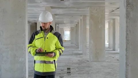 Architect Builder talking on the radio building under construction. Engineer in Stock Footage 113121713