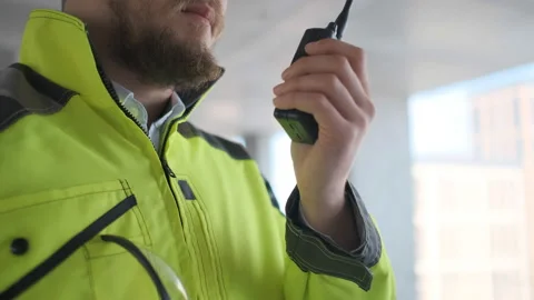 Architect Builder talking on the radio building under construction. Engineer in Stock Footage 113350805