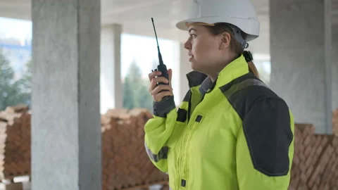 Architect Builder talking on the radio building under construction. Engineer in Stock Footage 113352560