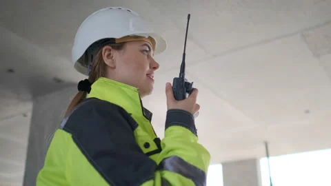 Architect Builder talking on the radio building under construction. Engineer in Stock Footage 113352638