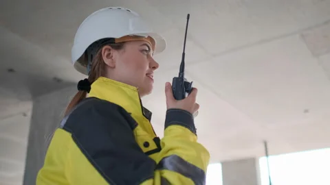 Architect Builder talking on the radio building under construction. Engineer in Video stock 114537437