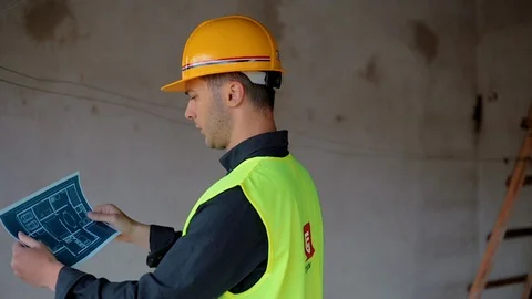 Architect ,checking blueprints Stock Footage 129443104