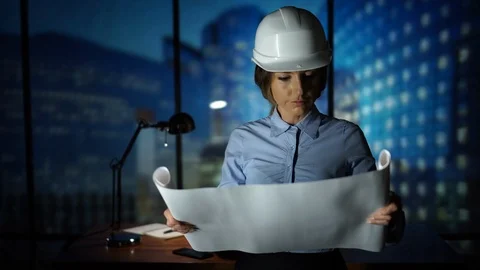 Architect checking construction project, blueprint, sketching a housing project Stock Footage 95411624