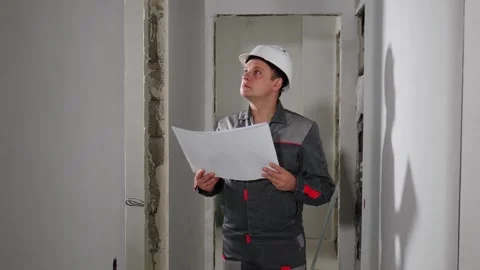 Architect checking construction stage in new apartment. not satisfied with Stock Footage 257305355