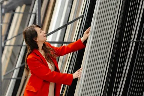 Architect choosing construction materials for new project in warehouse Stock Photos