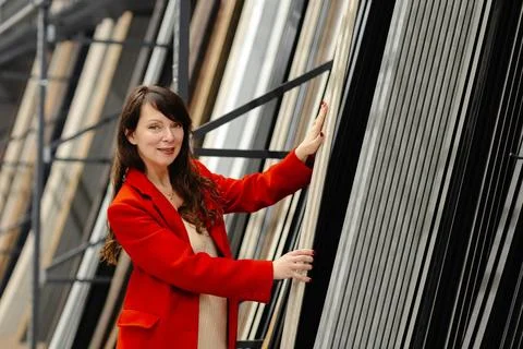 Architect choosing construction materials for new project in warehouse Stock Photos