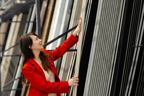 Architect choosing construction materials for new project in warehouse Stock Photos