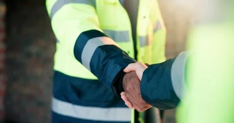 Architect, construction site and handshake for building agreement, project Stock Photos