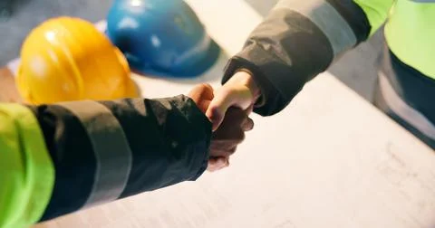 Architect, construction site and handshake for development agreement, project Stock Photos