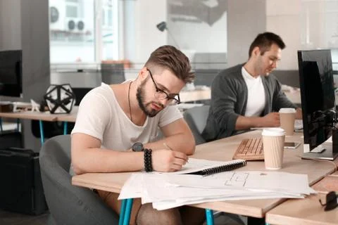 Architect-designer in the office Stock Photos