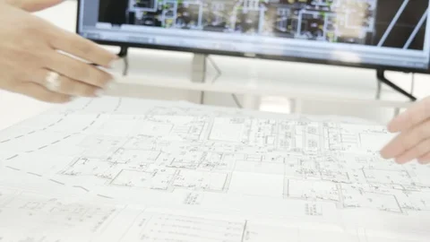 Architect, designer or engineers shaking hand in the office slow motion Stock Footage 99990257