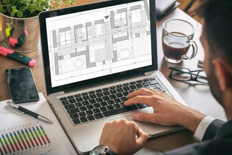 Architect designer working, Building project blueprint plan on a computer scr Ilustración de archivo