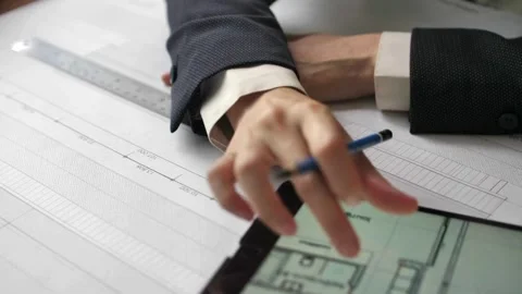 Architect designer working in office on tablet while holding stylus, Close up Stockbeeldmateriaal 336573731