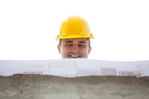 Architect designing a building standing on construction site Stock Photos
