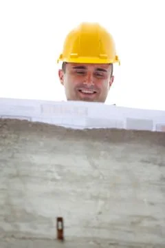 Architect designing a building standing on construction site Stock Photos