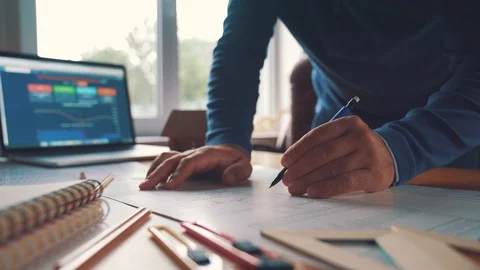 The architect develops and plans the premises of the building under construction Stock Footage 101283942