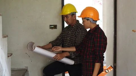 Architect discuss with engineer about project in office Stock Footage 89967818
