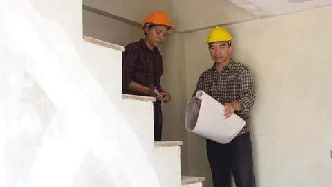 Architect discuss with engineer about project in construction site Stock Footage 91097776