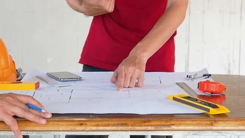 Architect discuss with engineer about project in construction site Stock Footage 94767847