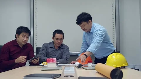 Architect discuss with engineer about project in office. Stock Footage 145669761