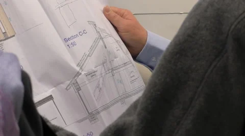 Architect discussing house plan standing Vídeos de archivo 58087581
