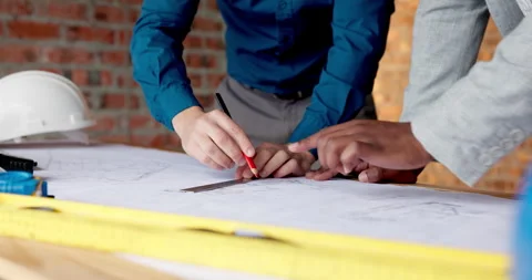 Architect, drawing and hands with floor plan in building, teamwork or ideas for Stock Footage 338395925