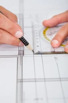 Architect drawing on blueprint Fotos de archivo