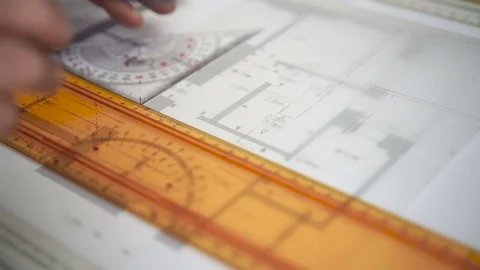 Architect drawing blueprints. Engineer Working with triangle ruler and pencil Stock Footage 73170754