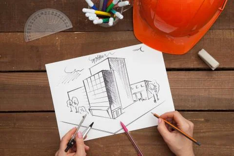 Architect drawing blueprints Stock Photos