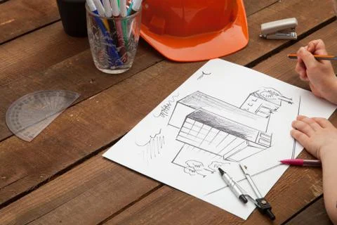 Architect drawing blueprints Stock Photos