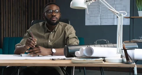 Architect drawing blueprints with professional Compass in Loft office.  Stock Footage 153692326