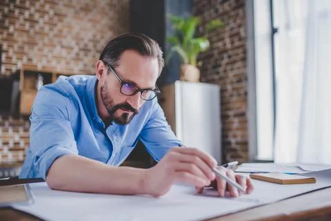 Architect drawing building plans Stock Photos