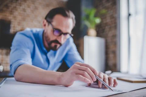 Architect drawing building plans Stock Photos