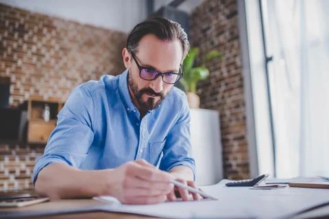 Architect drawing building plans Stock Photos